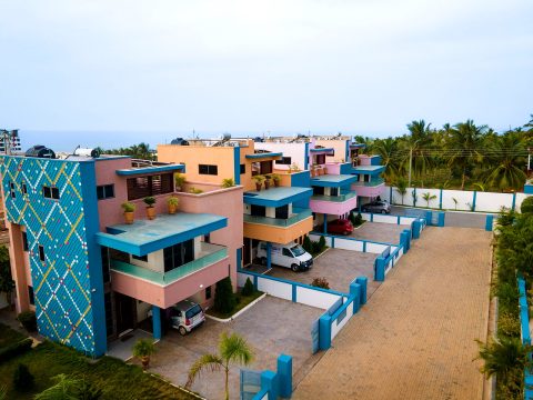 The row of apartment buildings along the private gated driveway