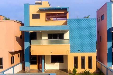 Front of one of the apartment buildings in orange and blue